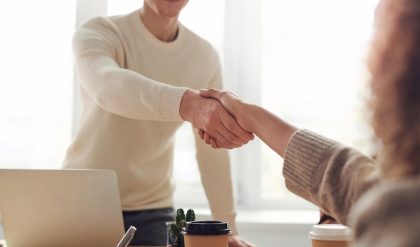 Shaking hands can clinch that deal, even with a robot
