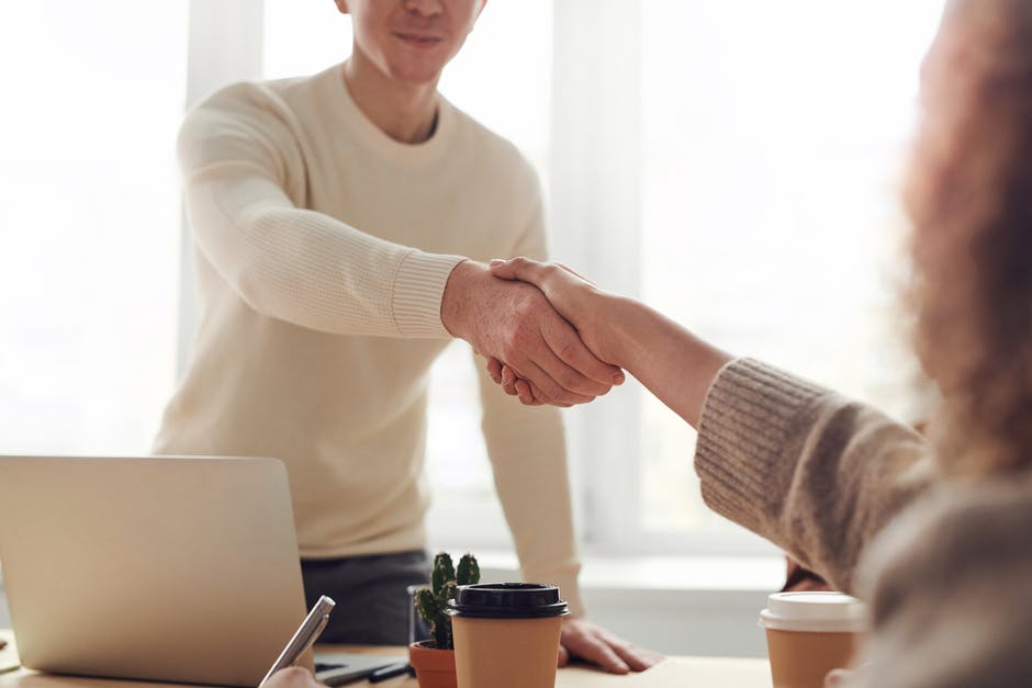 Shaking hands can clinch that deal, even with a robot