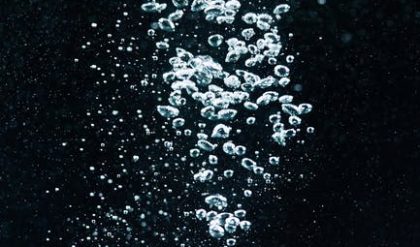 Mercury is darker because of carbon dusting caused by passing comets.